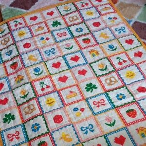 ban.do Quilted Throw Blanket with whimsical "Icons" pattern.